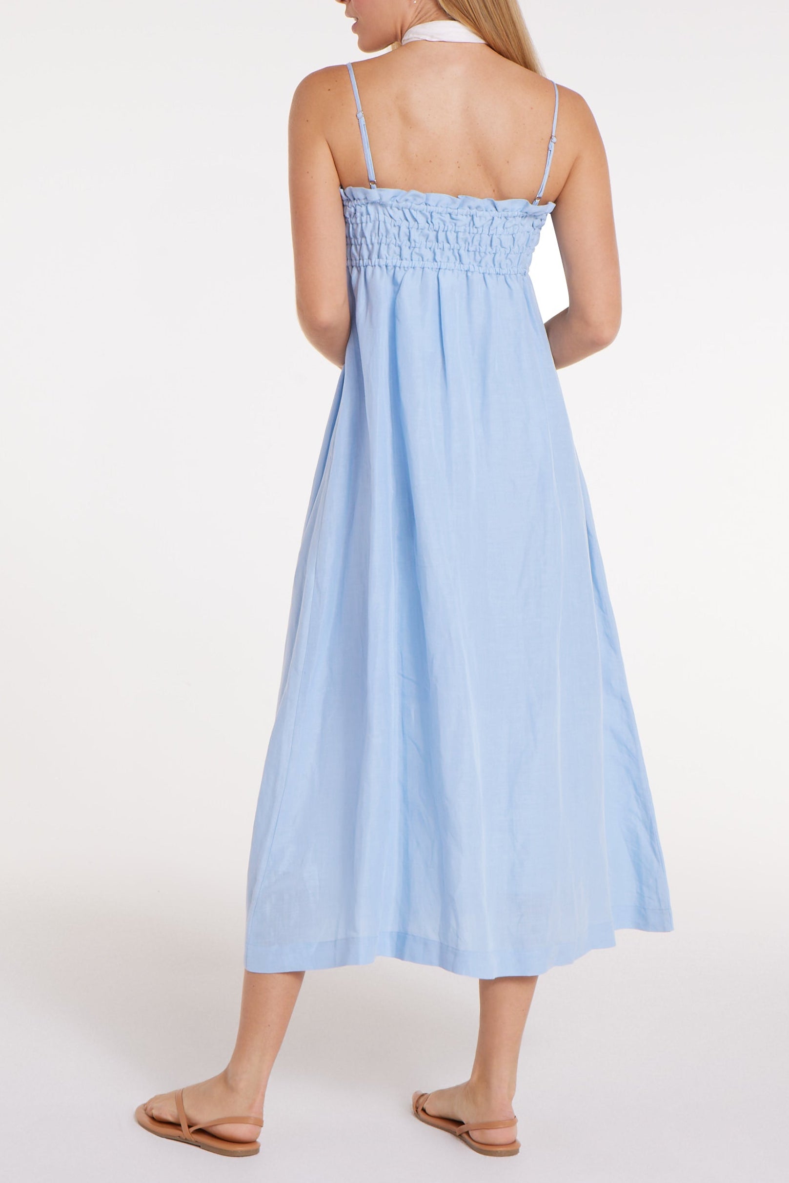 New in Margot Smocked Spaghetti Strap Midi Dress in Chambray Blue by Hermoza