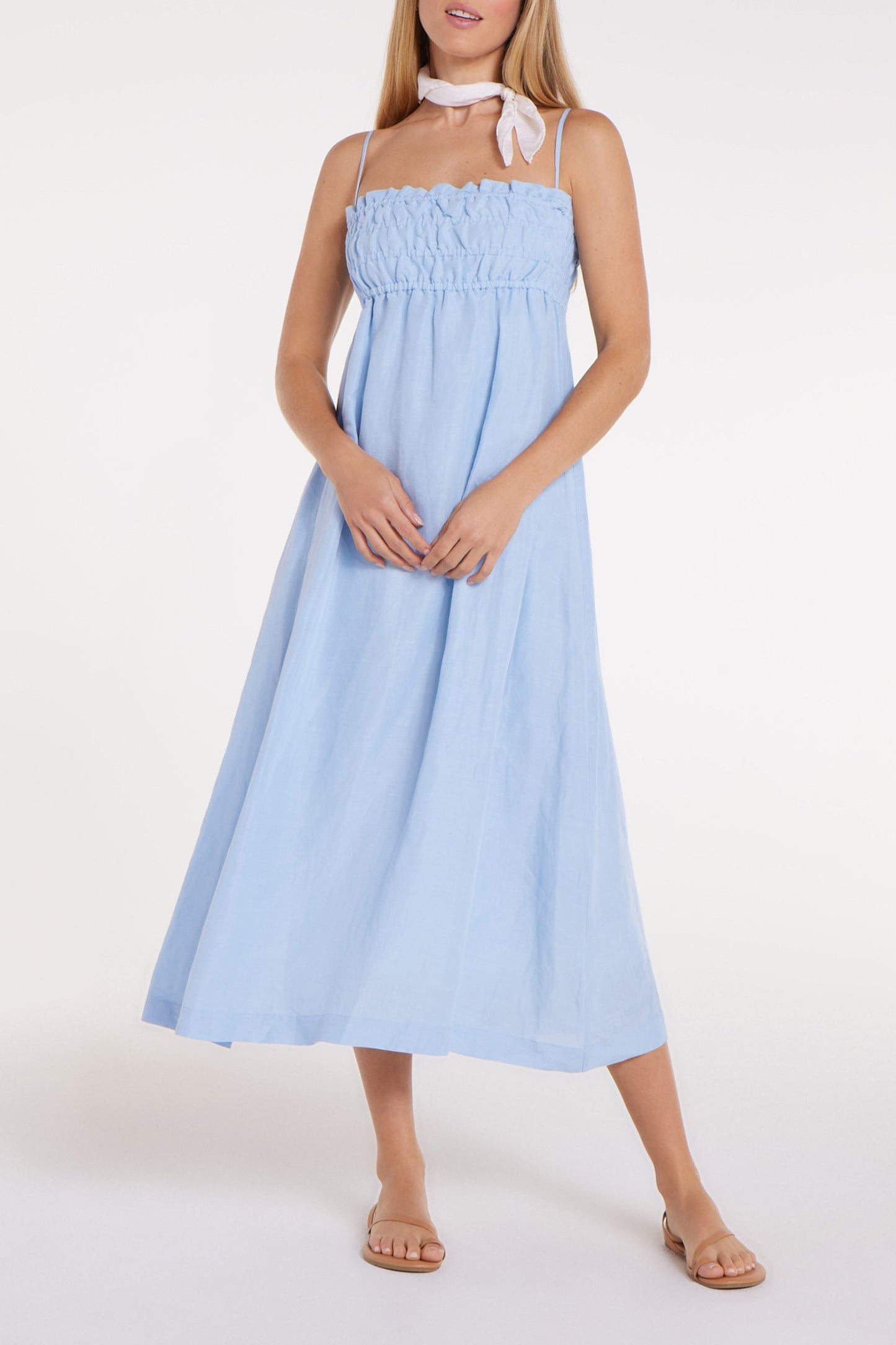 New in Margot Smocked Spaghetti Strap Midi Dress in Chambray Blue by Hermoza